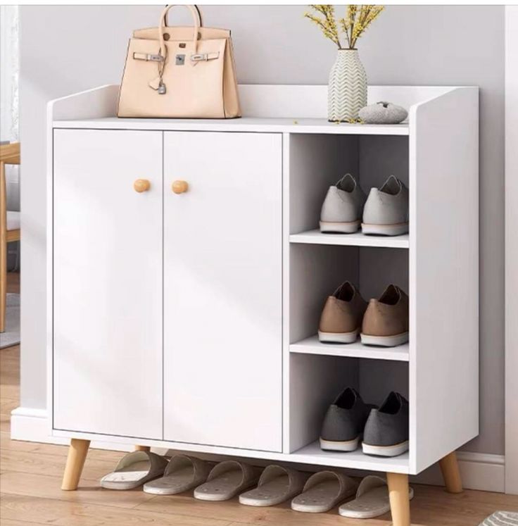Modern white shoe cabinet with open shelves and wood legs